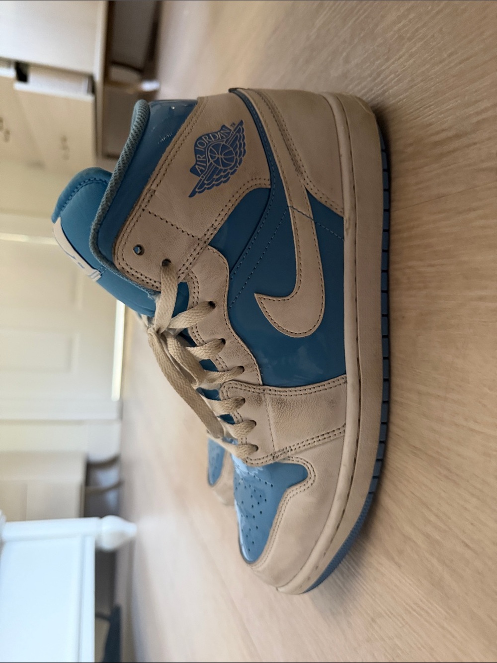 Air Jordan 1 High Top Sneakers in University Blue and Sail